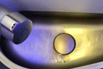 The Reason Some Experts Recommend Against Washing Your Hands in Airplane Bathrooms