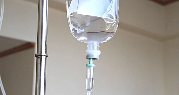 Why does IV saline drips (salt water) rehydrate us, but drinking salt water is harmful?