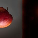 Which is faster gravity or light?