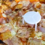 Why Do Pizza Boxes Have Those Tiny Plastic Tables?