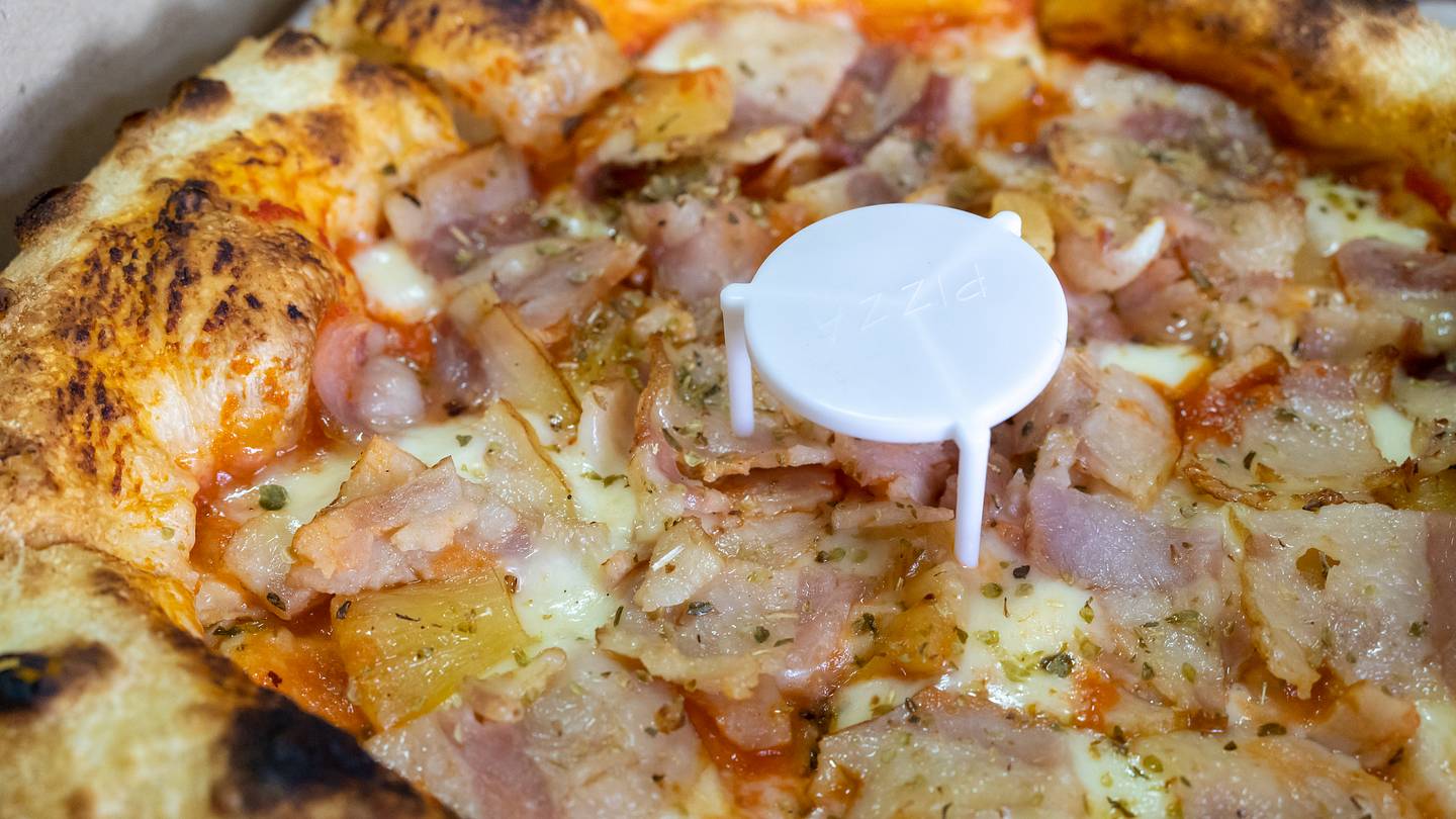 Why Do Pizza Boxes Have Those Tiny Plastic Tables?